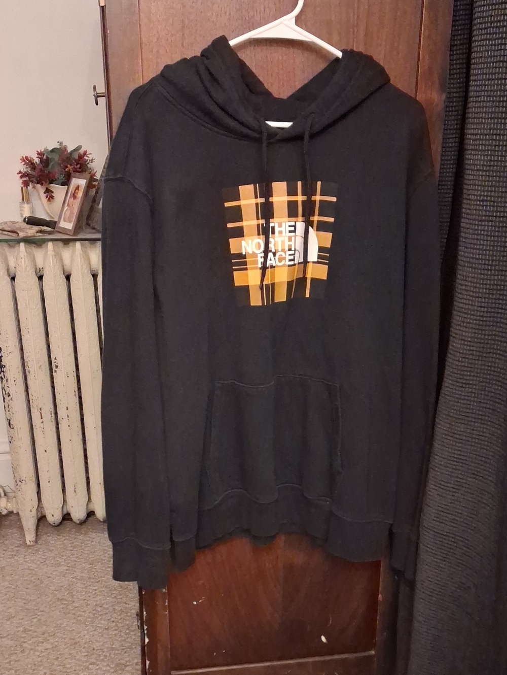 The North Face Black Hoodie with Yellow & Orange Plaid Logo